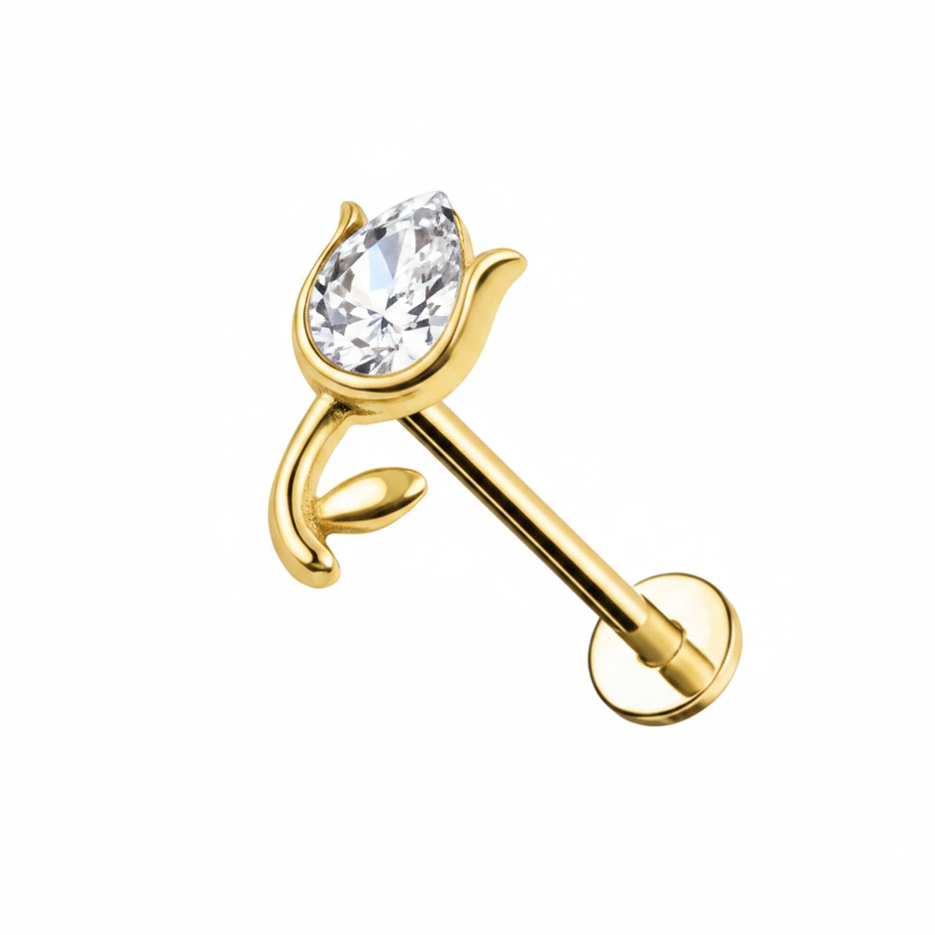 Piercing labret cristallo a goccia oro su sfondo bianco